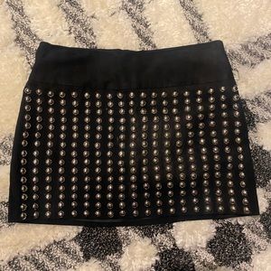 Black mini skirt with round metal studs…